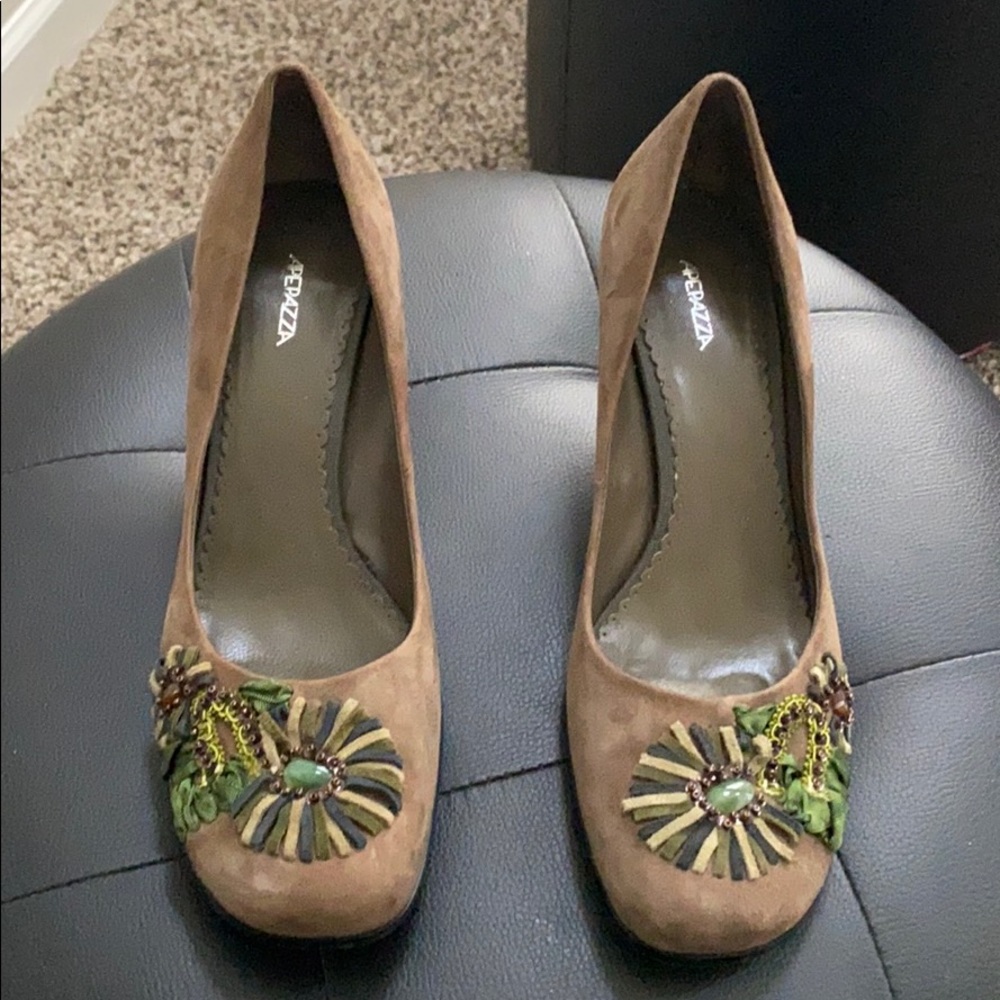 Brown suede pumps with beautiful designs..